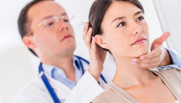 Doctor examining a patient with neck pain